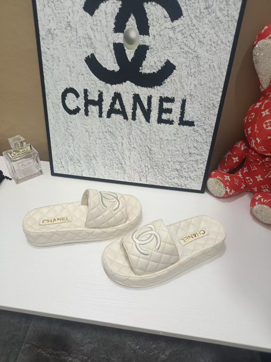 Chanel 26s Quilted Slide Sandals In White Calfskin