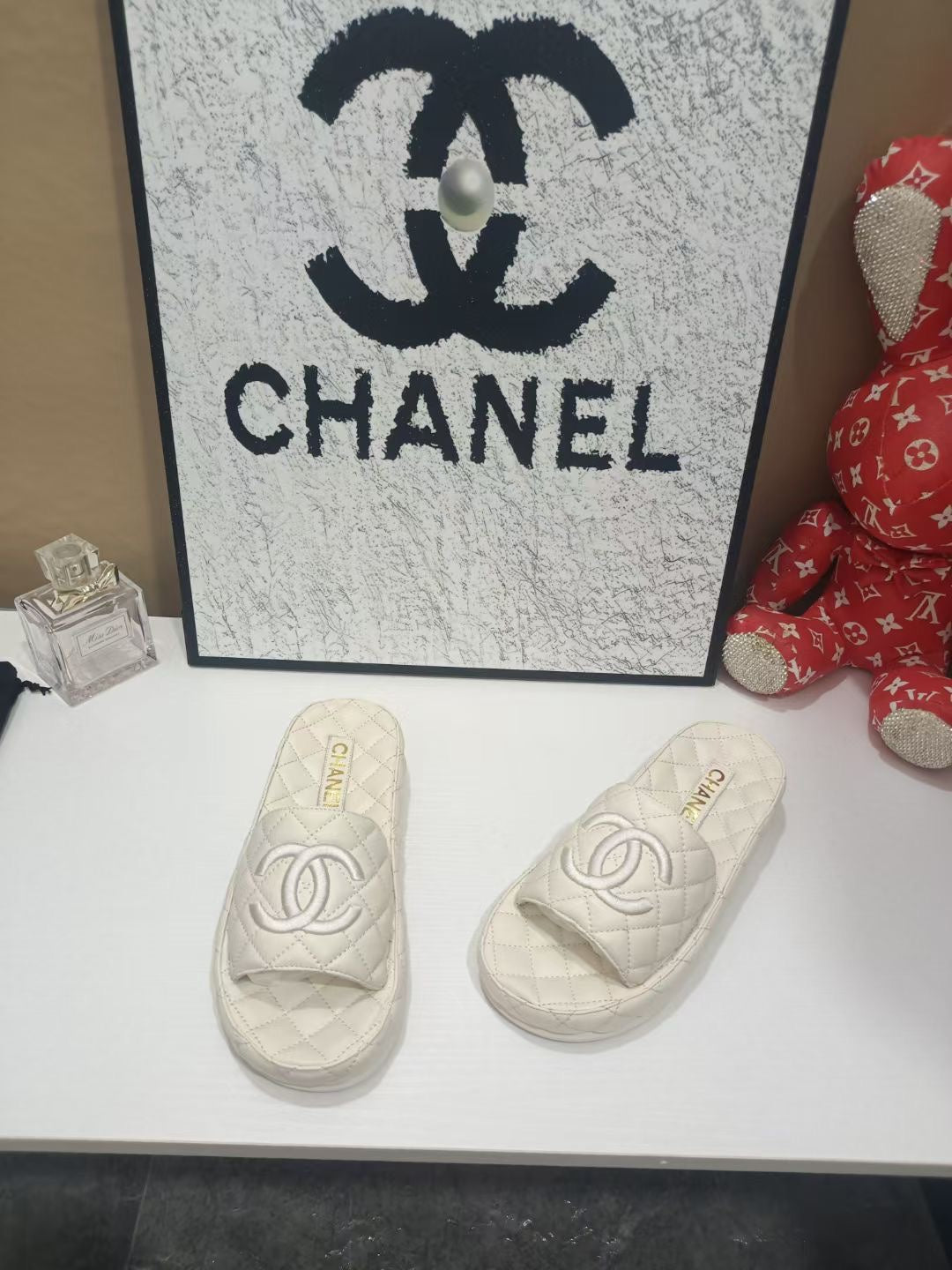 Chanel 26s Quilted Slide Sandals In White Calfskin